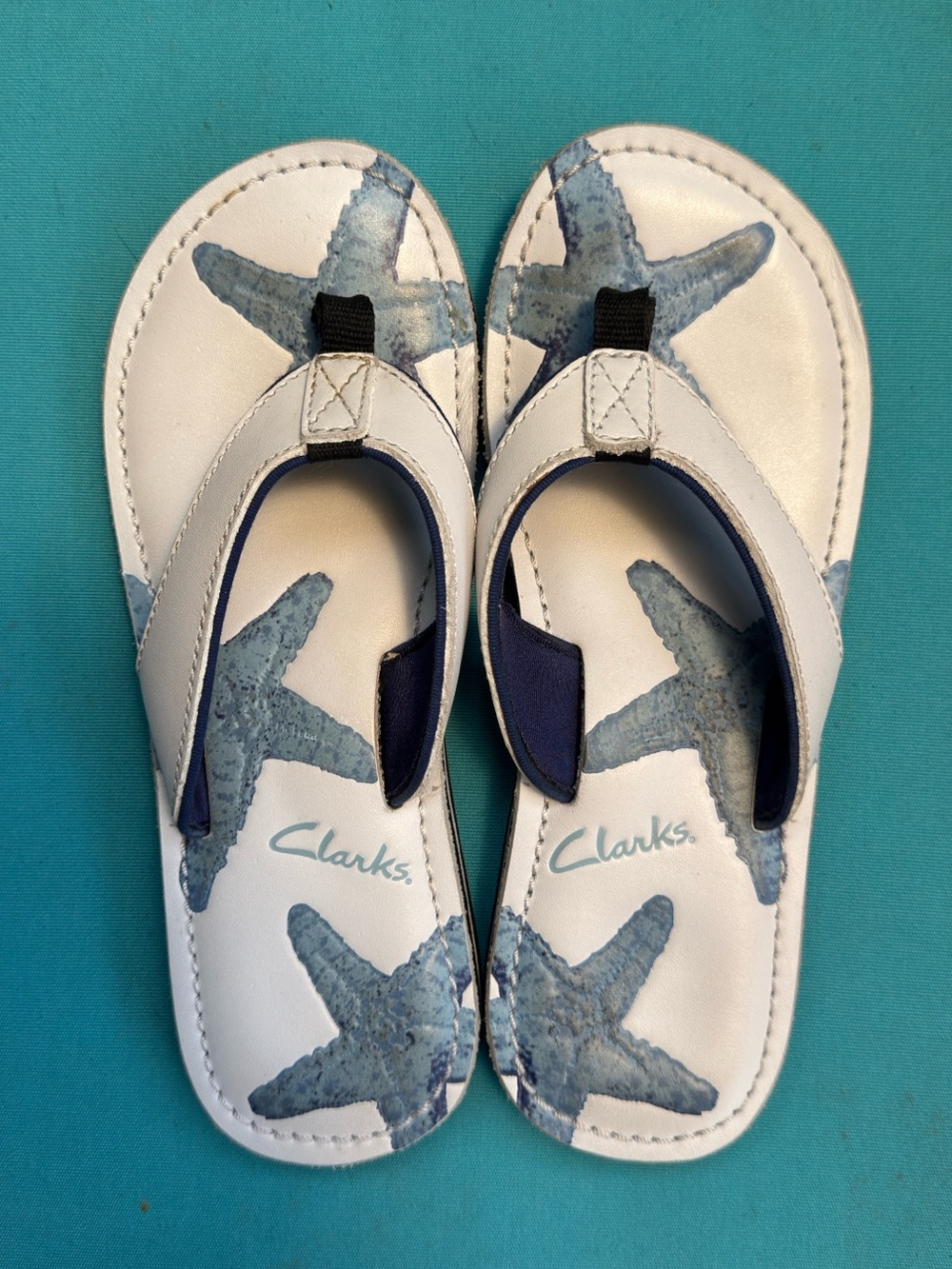 Clarks Women’s Tahiti Starfish Thong Sandals white and teal blue